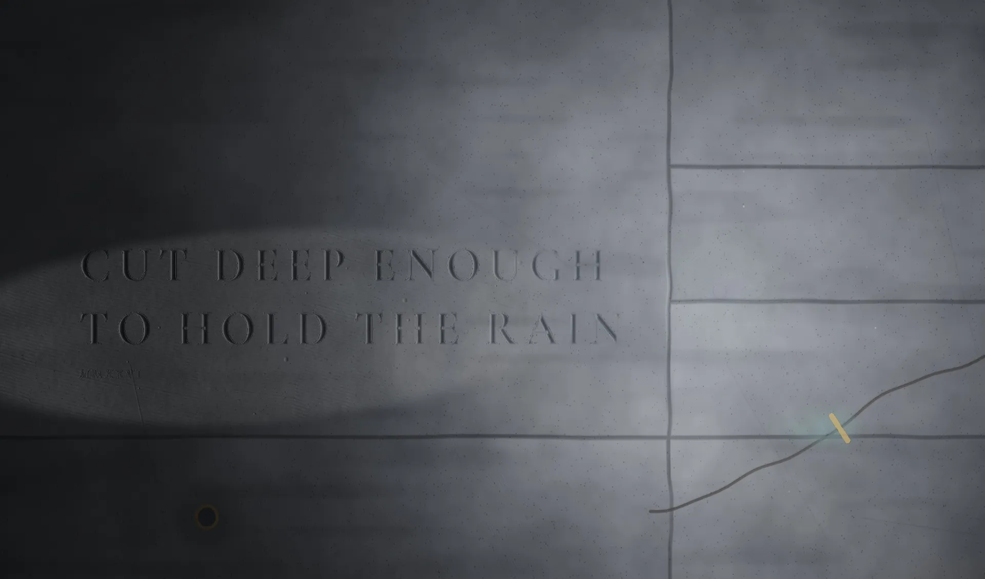 Morning: a blade of light across the dark stone floor, the cut words CUT DEEP ENOUGH TO HOLD THE RAIN half lit