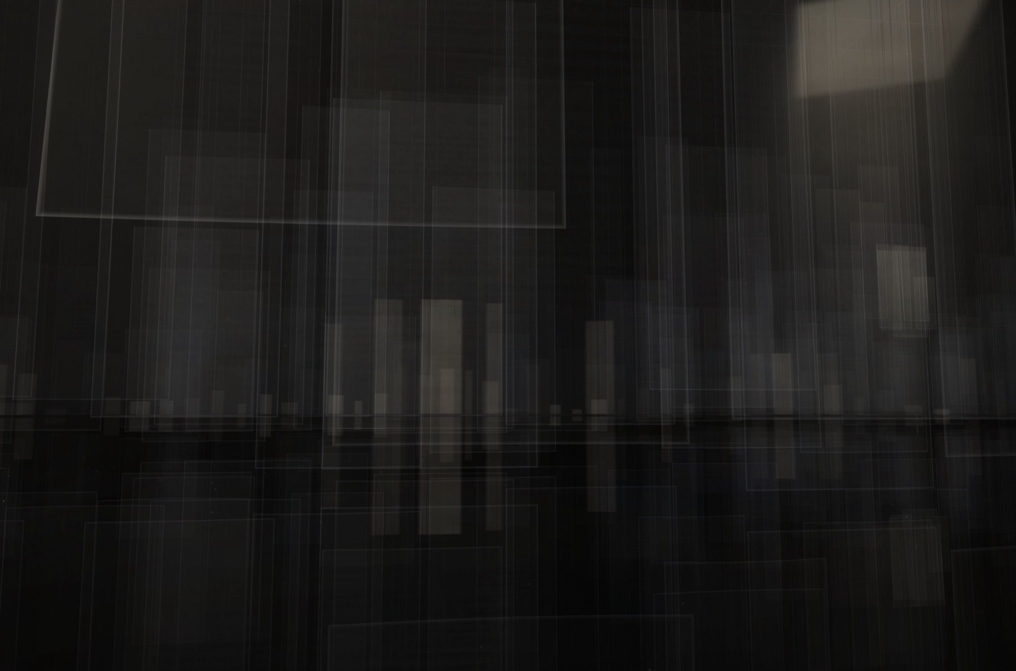 A large sheet suspended high at the upper left; below, small rectangles of light on the horizon reflected in black water